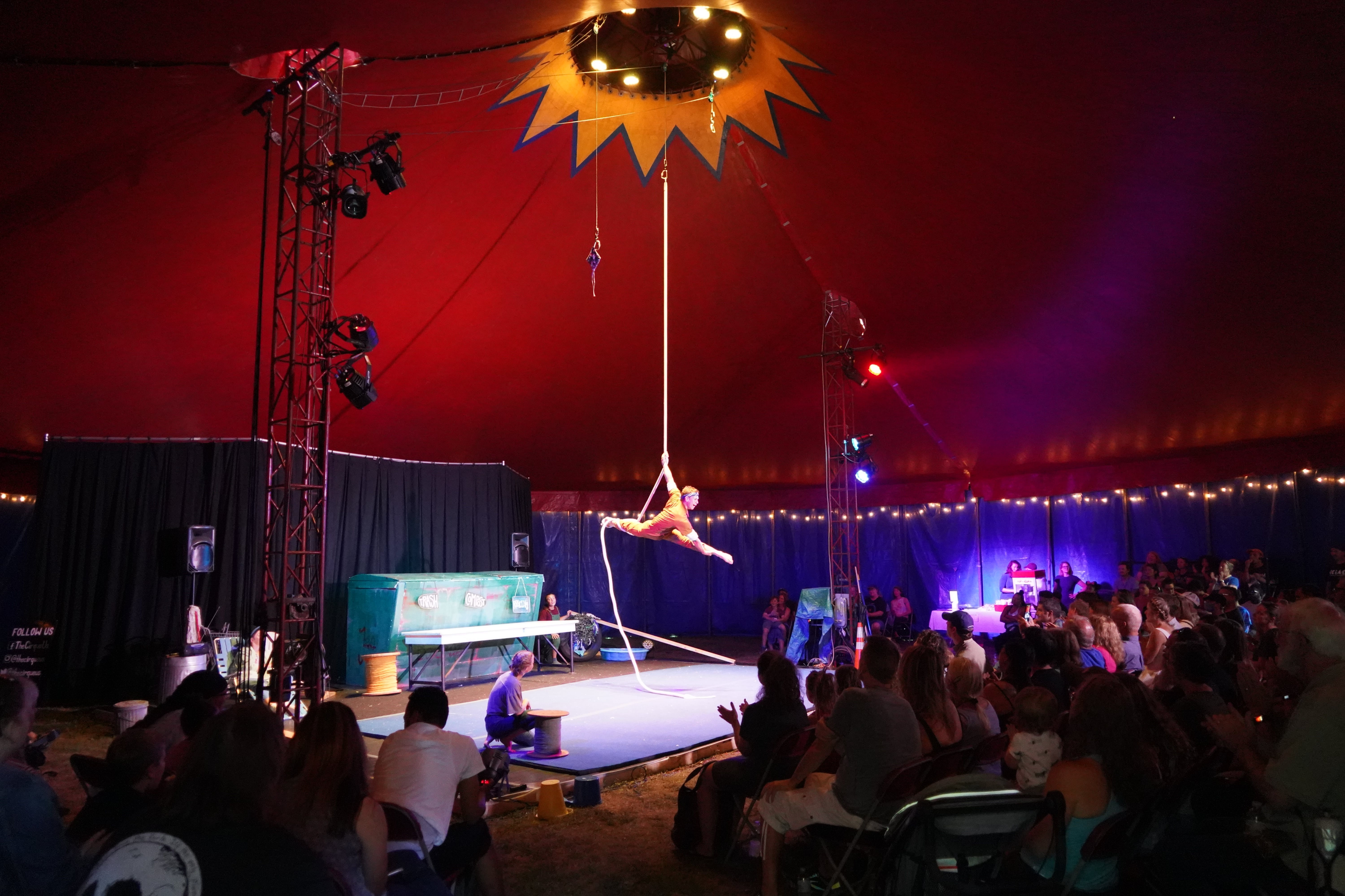Aerialist and audience in CCIAC bigtop tent  in Troy's Prospect Park.