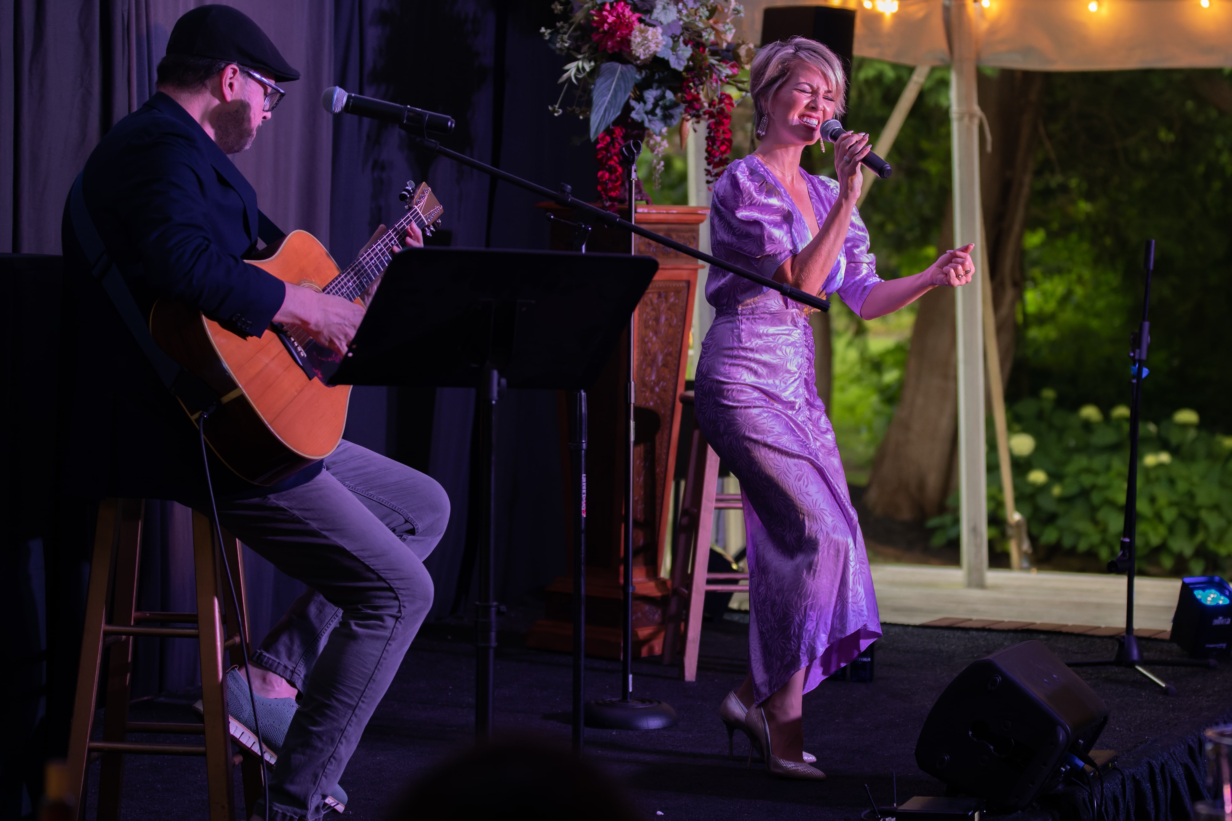 Guitar player and woman on stage