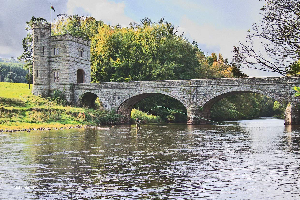 The Fishing Tower and fisherman in action in the river Usk on the Glanusk Estate