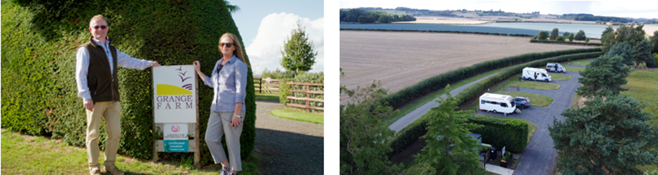 A couple stands beside the sign of Grange Farm campsite in a well-maintained area with hedges.